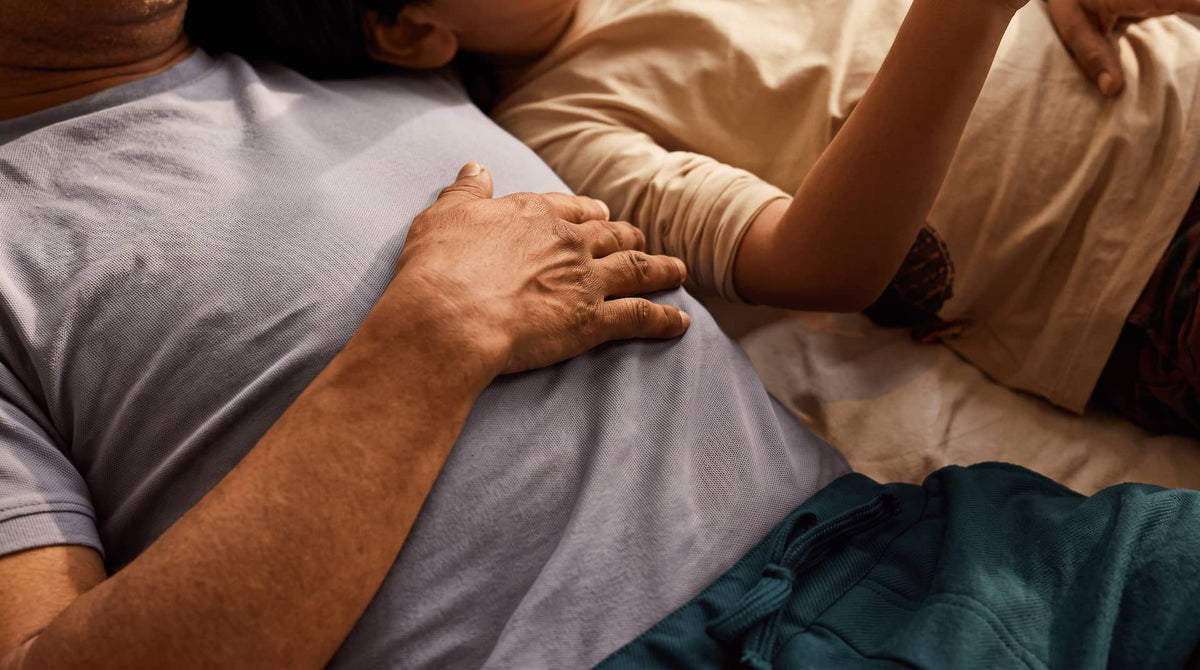 Two people lying down and resting together